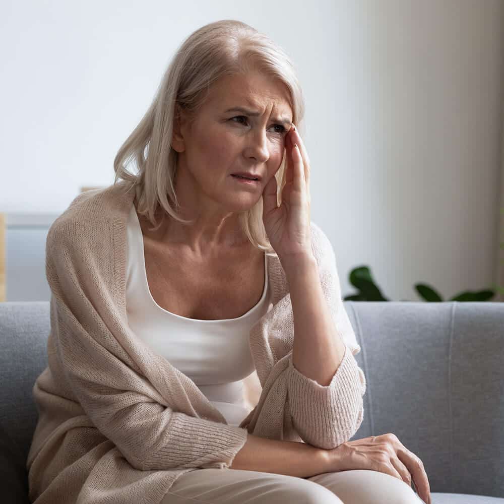 older woman unhappy with joint pain